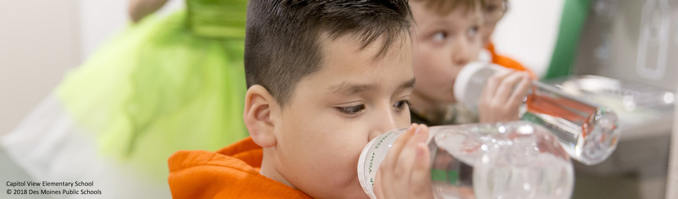 Child drinking from water bottle