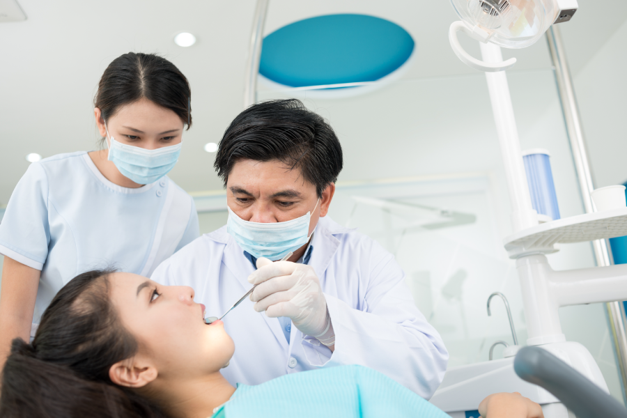 image of dentist, hygienist and patient