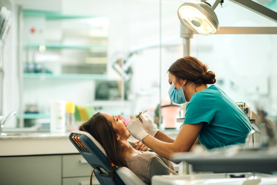 Woman getting dental work done