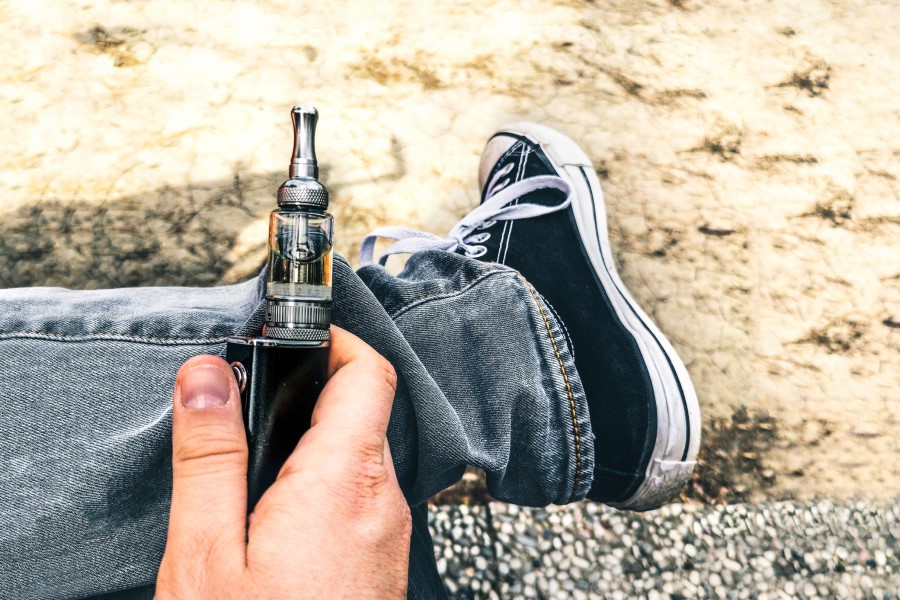 Man holding vaping device