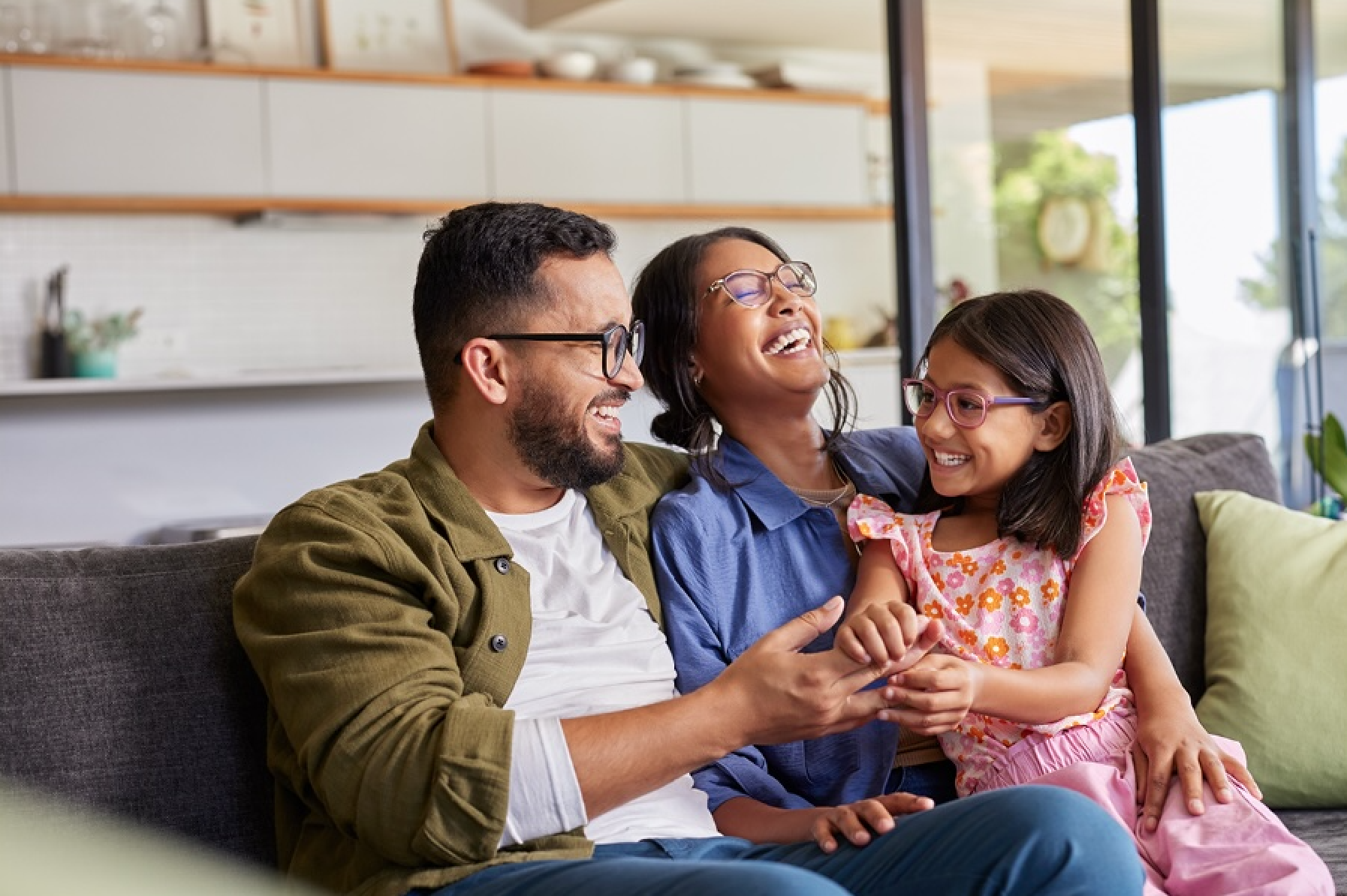 Family smiling and laughing together.