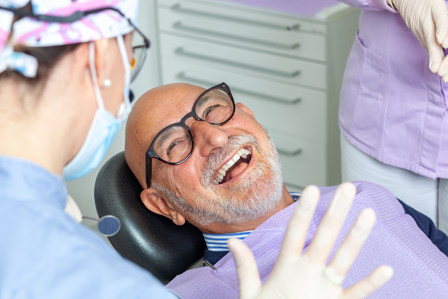 Person smiling at the dentist.