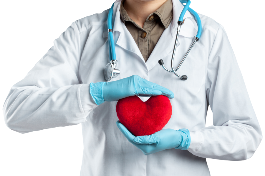Doctor holding a heart pillow.