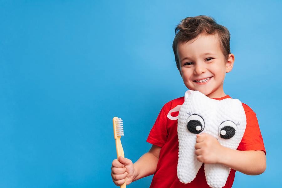 Child Holding Toothbrush