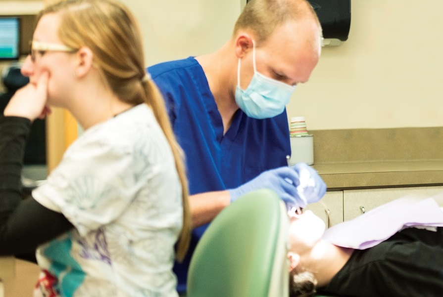 Dentist with patient