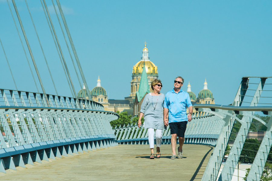 Middle age couple walking on bridge