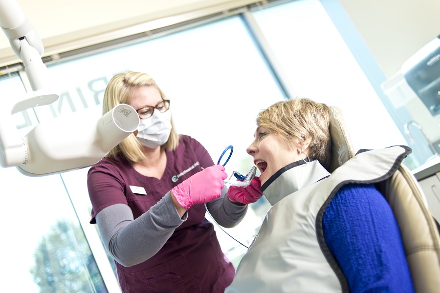 Dentist talking to patient