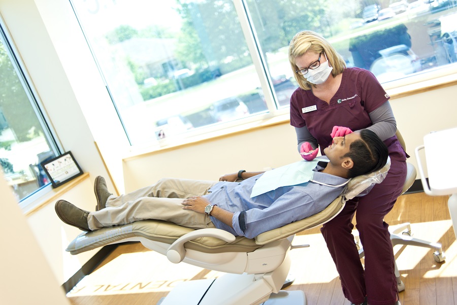 Dentist looking at patient