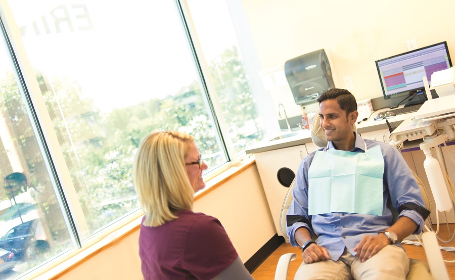 dentist sitting with patient