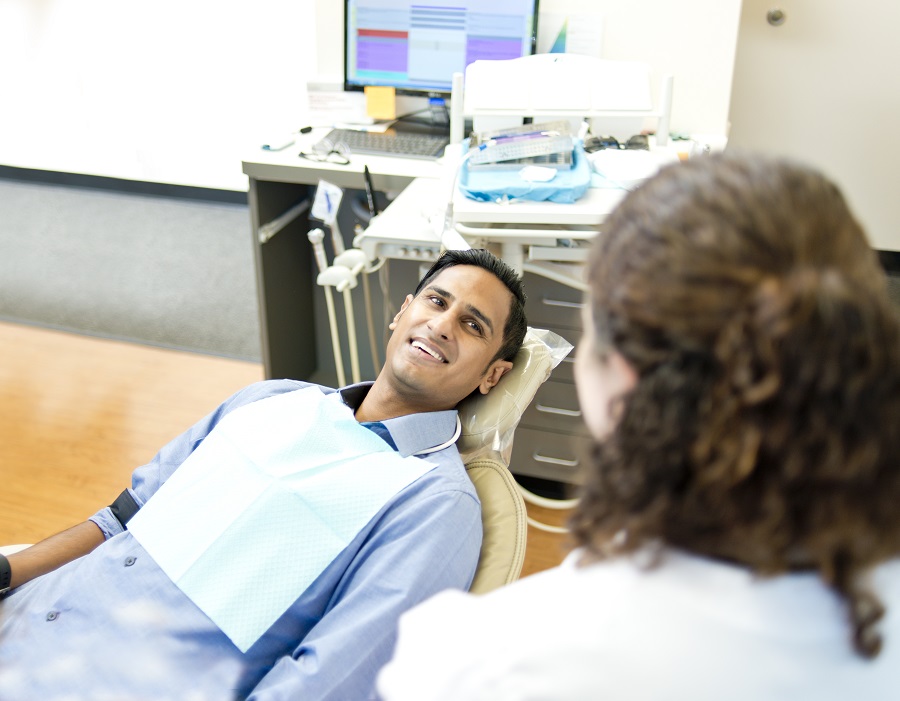 Dentist talking to patient