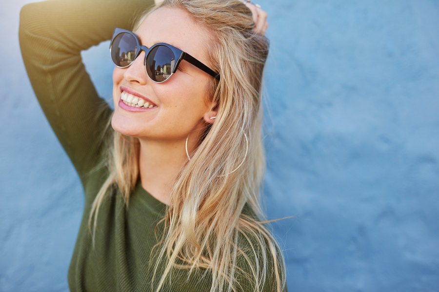 girl with sunglasses smiling