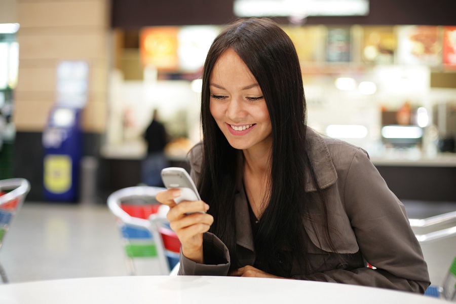 Girl sitting on her phone