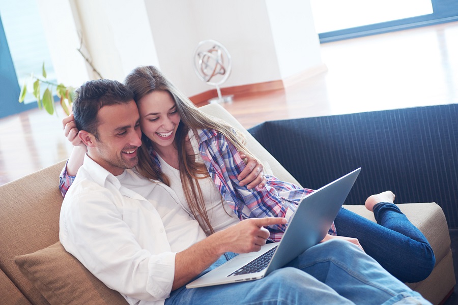 Couple watching something on a computer