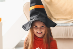 photo of smiling girl in witch hat