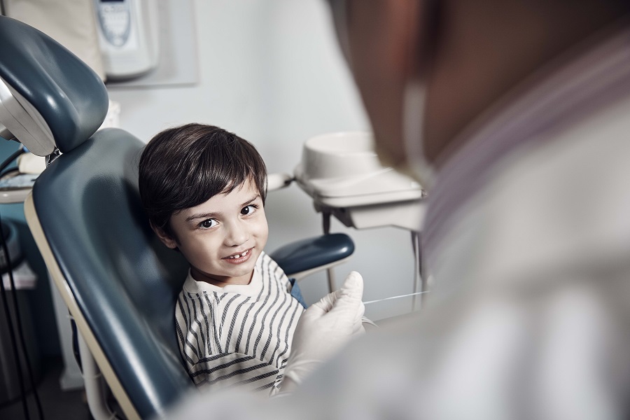Little boy sitting in a dentist chair