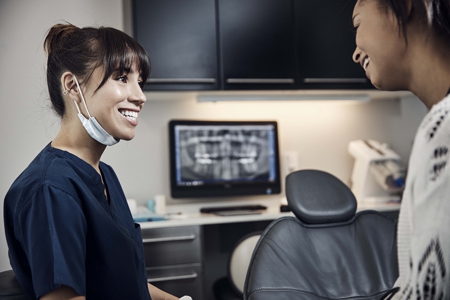 Dentist talking to patient