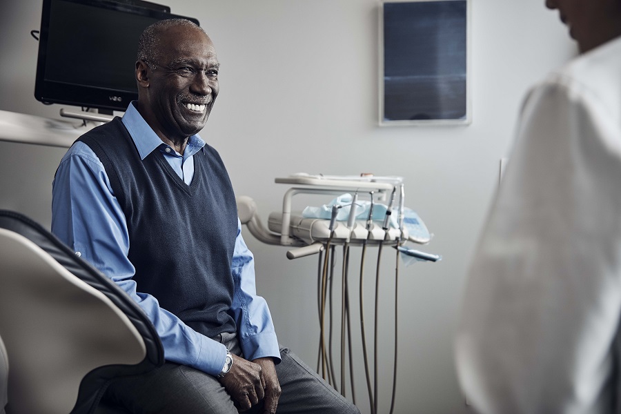 male patient sitting in dentist room