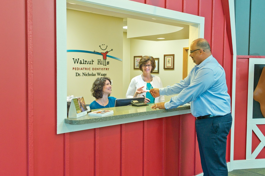 Man talking to a front desk