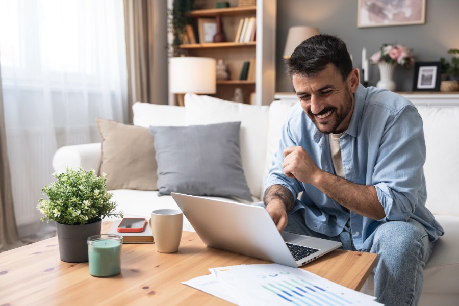 man with laptop and calculator