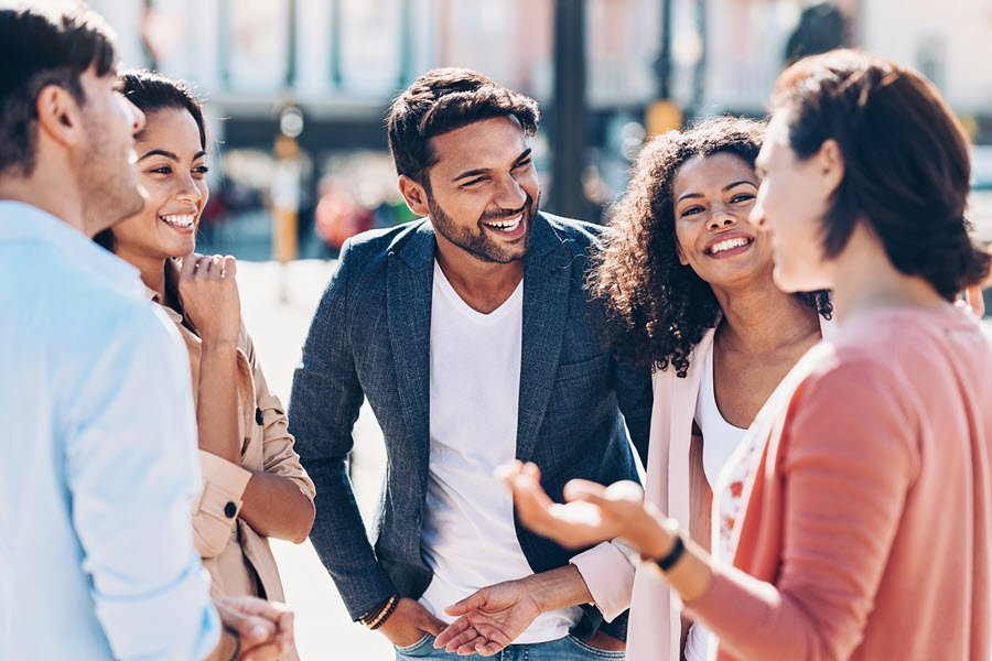 Group of people talking and laughing