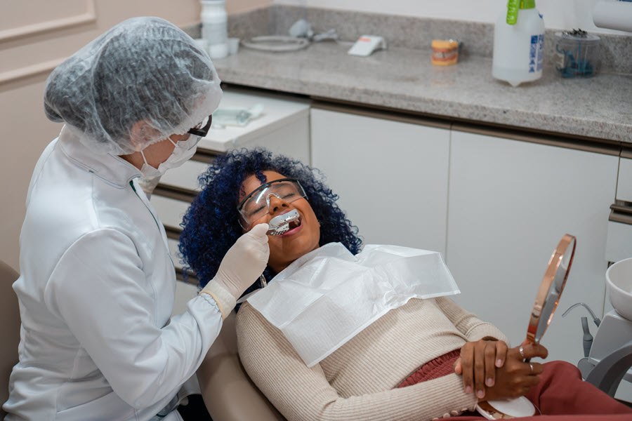 Woman sitting in dentist chair