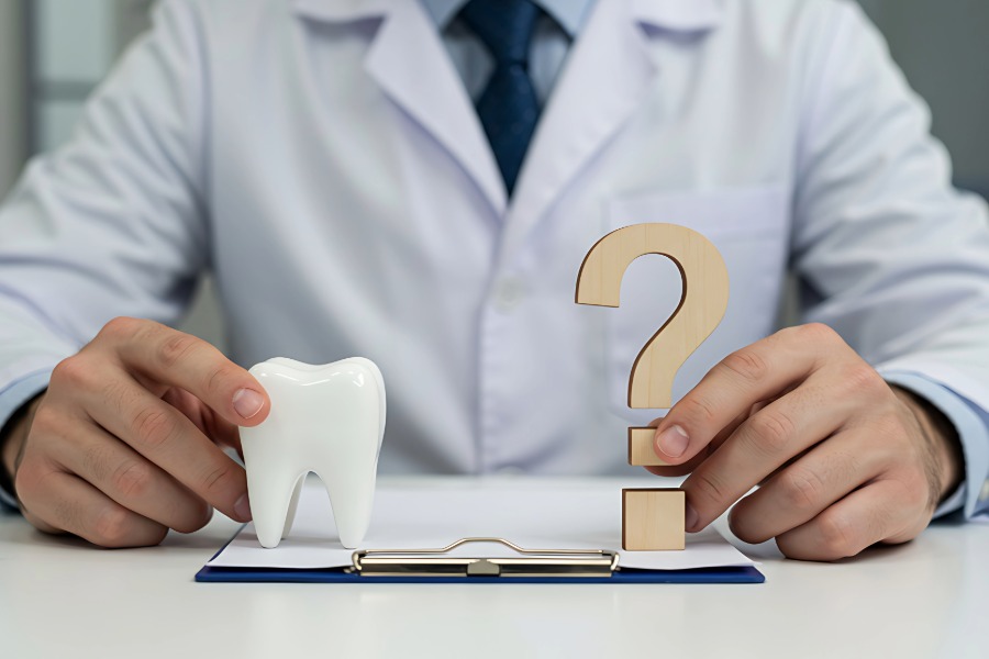 dentist sitting at a desk with notebook