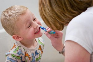 Mom-with-child-brushing-teeth