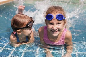 Chlorine might not be your teeth's best friend, but don't let pool chemicals prevent you from diving in!