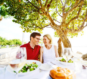 Lovely Mature Couple Enjoying Food in a Restaurant