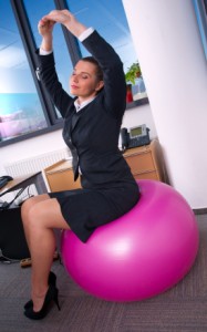 woman in office stretching