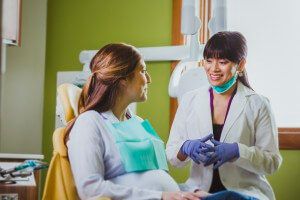 pregnant at dentist gloves